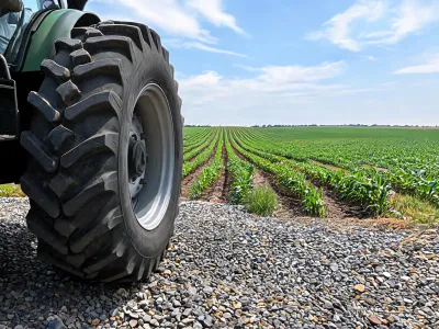Utility tractor tire on mixed farm ground